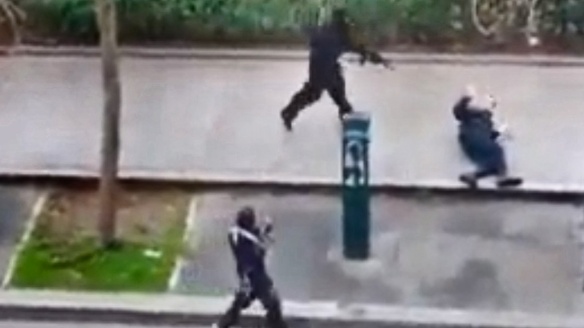 Charlie Hebdo attackers killing a police officer as he's defenseless on the ground.